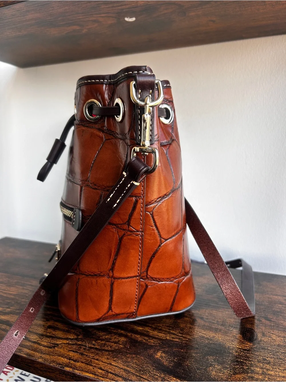 Dooney & Bourke Croc Embossed Leather Drawstring Bucket Crossbody Cognac